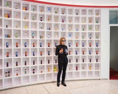 YOSHIKI Standing in front of Coca-Cola shelf holding Real Gold X/Y